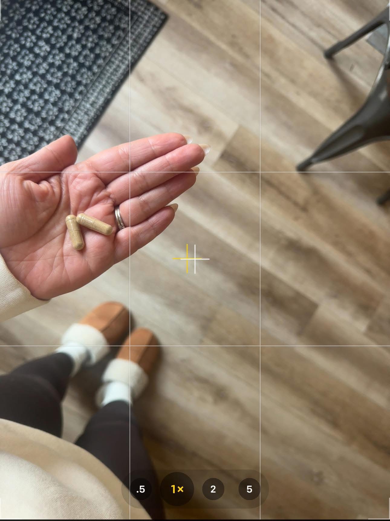 Two peptide capsules in a hand — what taking The Protocol looks like every morning